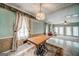 Elegant dining room with decorative wallpaper, a chandelier, and tile floors at 3170 Ebenezer Rd, Marietta, GA 30066