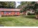 Beautiful brick home with manicured landscaping and lush green lawn at 3170 Ebenezer Rd, Marietta, GA 30066