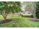 Charming brick home with well-maintained lawn, mature trees, and manicured landscaping at 3170 Ebenezer Rd, Marietta, GA 30066
