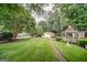 Well-manicured front yard with lush green grass and a charming gazebo at 3170 Ebenezer Rd, Marietta, GA 30066