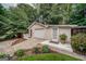 Garage with a well-maintained driveway and beautiful landscaping at 3170 Ebenezer Rd, Marietta, GA 30066