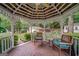 Cozy gazebo interior with ceiling fan and comfortable seating for outdoor relaxation at 3170 Ebenezer Rd, Marietta, GA 30066
