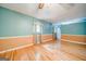 Living room with hardwood floors, chair rail detail, and built in shelving at 3170 Ebenezer Rd, Marietta, GA 30066