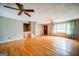 Bright living room featuring hardwood floors, a ceiling fan, and staircase at 3170 Ebenezer Rd, Marietta, GA 30066