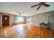 Spacious living room with hardwood floors, ceiling fan, and sliding barn doors at 3170 Ebenezer Rd, Marietta, GA 30066
