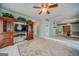 Open living area features entertainment center, tile flooring, and seamless access to dining spaces at 3170 Ebenezer Rd, Marietta, GA 30066