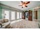 Bright living area with French doors, a vintage entertainment center, and neutral tile flooring at 3170 Ebenezer Rd, Marietta, GA 30066