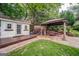 Outdoor patio with comfortable seating, a shed, and a well-kept lawn at 3170 Ebenezer Rd, Marietta, GA 30066