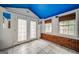 Sun room with blue ceiling, exposed brick and plenty of natural light at 3170 Ebenezer Rd, Marietta, GA 30066