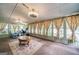 Bright sunroom with multiple windows and ceiling fan at 3170 Ebenezer Rd, Marietta, GA 30066