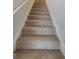 Carpeted staircase leading to the upper level of the home at 55 Heyman Drive # 83, Covington, GA 30016