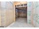 Unfinished basement with concrete walls and flooring at 65 Oakhurst Trl, Sharpsburg, GA 30277