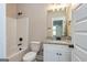 Bathroom boasts a vanity with granite countertop at 65 Oakhurst Trl, Sharpsburg, GA 30277