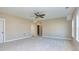 Spacious bedroom with ceiling fan and neutral decor at 65 Oakhurst Trl, Sharpsburg, GA 30277