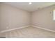 Simple bedroom with neutral walls and carpeted floor at 65 Oakhurst Trl, Sharpsburg, GA 30277