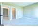Bedroom with two closets and access to hallway at 65 Oakhurst Trl, Sharpsburg, GA 30277