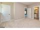 Spacious bedroom with carpet flooring and neutral wall tones at 65 Oakhurst Trl, Sharpsburg, GA 30277
