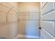 Spacious walk-in closet with wire shelving at 65 Oakhurst Trl, Sharpsburg, GA 30277