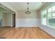 Formal dining room featuring hardwood floors and wainscoting at 65 Oakhurst Trl, Sharpsburg, GA 30277