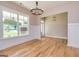 Bright dining area with hardwood floors and a view of the entry at 65 Oakhurst Trl, Sharpsburg, GA 30277