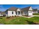 Craftsman style home with attached garage and landscaping at 65 Oakhurst Trl, Sharpsburg, GA 30277