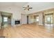 Open living area with hardwood floors, a stone fireplace and high ceilings at 65 Oakhurst Trl, Sharpsburg, GA 30277