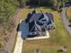 Aerial view of two-story house, driveway, and landscaping at 20 Platinum Rdg, Sharpsburg, GA 30277