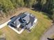 House and lot aerial view showcasing the home's design and backyard at 20 Platinum Rdg, Sharpsburg, GA 30277