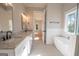 Spa-like bathroom with double vanity, soaking tub, and walk-in shower at 20 Platinum Rdg, Sharpsburg, GA 30277