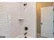 Modern bathroom with subway tile shower and granite countertop vanity at 20 Platinum Rdg, Sharpsburg, GA 30277