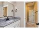 Bathroom with granite countertop, black fixtures and a modern mirror at 20 Platinum Rdg, Sharpsburg, GA 30277