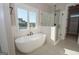 Luxurious bathroom with soaking tub, walk-in shower, and modern fixtures at 20 Platinum Rdg, Sharpsburg, GA 30277
