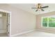 Charming bedroom with a view, ceiling fan and neutral decor at 20 Platinum Rdg, Sharpsburg, GA 30277
