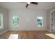 Bright bedroom with hardwood floors, ceiling fan and large windows at 20 Platinum Rdg, Sharpsburg, GA 30277