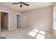 Bright bedroom with two closets, ceiling fan, and neutral decor at 20 Platinum Rdg, Sharpsburg, GA 30277