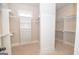 Large walk-in closet with built-in shelving and rods at 20 Platinum Rdg, Sharpsburg, GA 30277
