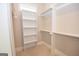 Walk-in closet with custom shelving and built-in storage at 20 Platinum Rdg, Sharpsburg, GA 30277