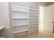 Large walk-in closet with custom shelving units at 20 Platinum Rdg, Sharpsburg, GA 30277