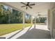 Spacious covered patio with ceiling fans and view of backyard at 20 Platinum Rdg, Sharpsburg, GA 30277