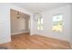 Formal dining room with hardwood floors, wainscoting, and a modern chandelier at 20 Platinum Rdg, Sharpsburg, GA 30277