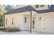 Exterior view of house with garage and side entrance at 20 Platinum Rdg, Sharpsburg, GA 30277