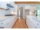 Modern kitchen with white cabinets, quartz countertops, and a farmhouse sink at 20 Platinum Rdg, Sharpsburg, GA 30277