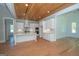 Kitchen boasts white cabinets, quartz counters and island at 20 Platinum Rdg, Sharpsburg, GA 30277