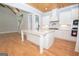 Kitchen with white cabinets and large island at 20 Platinum Rdg, Sharpsburg, GA 30277