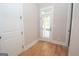 Bright laundry area with hardwood floors and access to the backyard at 20 Platinum Rdg, Sharpsburg, GA 30277