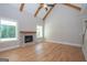 Living room with hardwood floors and stone fireplace at 20 Platinum Rdg, Sharpsburg, GA 30277