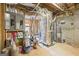 An unfinished basement with an HVAC system, water heater, and electrical panel at 25 Abelia Dr, Covington, GA 30014