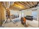 A basement that has exposed ductwork and exposed beams at 25 Abelia Dr, Covington, GA 30014