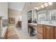 Bathroom featuring a large mirror over a vanity and tiled floors at 25 Abelia Dr, Covington, GA 30014