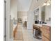 A bright bathroom is shown with a large vanity and tiled floors at 25 Abelia Dr, Covington, GA 30014